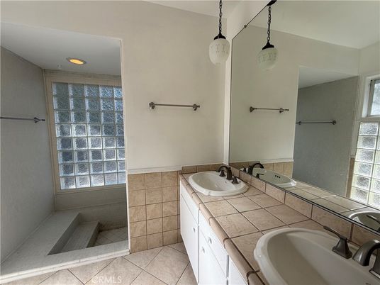 Bathroom, Dual Sink Vanities, Interior, Pendant Lights, Recessed Lighting, Tile Countertops