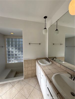 Bathroom, Dual Sink Vanities, Interior, Pendant Lights, Recessed Lighting, Tile Countertops