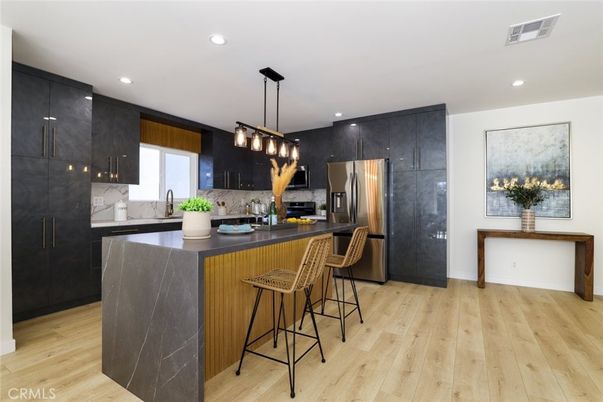 Interior, Kitchen, Marble Walls, Pendant Lights, Recessed Lighting, Stainless Steel Appliances, Wood Texture Flooring