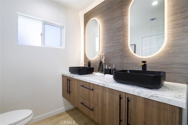 Bathroom, Dual Sink Vanities, Interior, Recessed Lighting, Wood Texture Flooring
