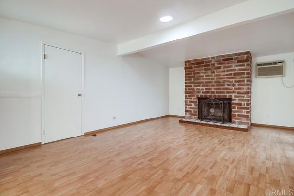 Empty room, Fireplace, Interior, Recessed Lighting, Stone Walls, Wood Texture Flooring
