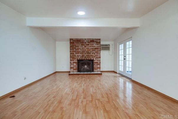 Empty room, Fireplace, Interior, Recessed Lighting, Stone Walls, Wood Texture Flooring