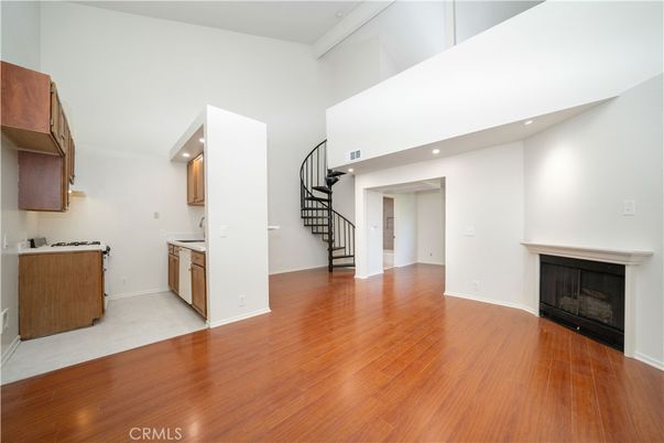 Empty room, Fireplace, Interior, Kitchen, Recessed Lighting, Wood Texture Flooring