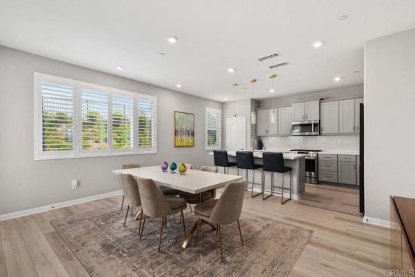 Dining room, Interior, Kitchen, Pendant Lights, Recessed Lighting, Stainless Steel Appliances, Wood Texture Flooring