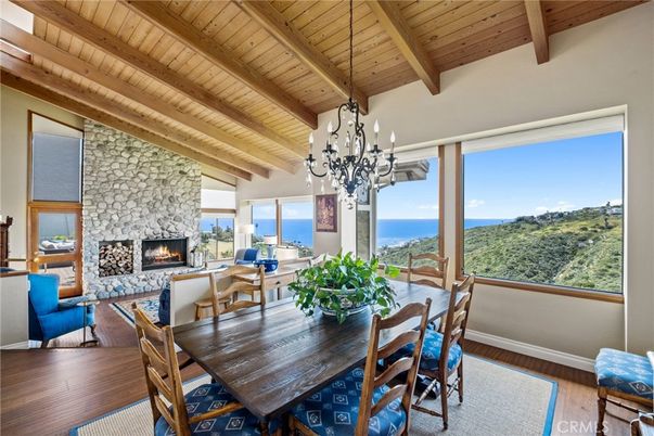 Chandelier, Dining room, Fireplace, Interior, Living room, Stone Walls, Water, Wooden Beams, Wooden Ceilings, Wood Texture Flooring