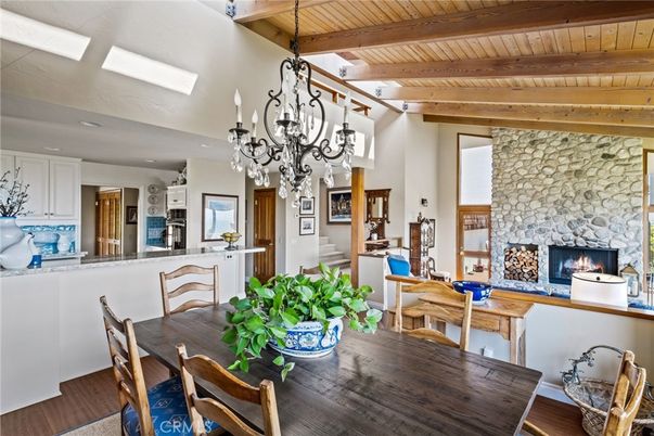 Chandelier, Dining room, Fireplace, Interior, Kitchen, Recessed Lighting, Stone Walls, Wooden Beams, Wooden Ceilings, Wood Texture Flooring