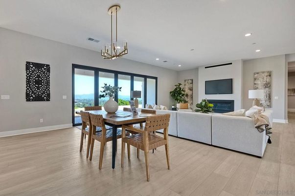 Dining room, Fireplace, Interior, Living room, Pendant Lights, Recessed Lighting, Wood Texture Flooring