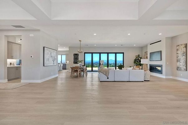 Chandelier, Dining room, Fireplace, Interior, Living room, Pendant Lights, Recessed Lighting, Wood Texture Flooring