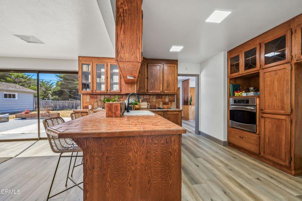 Interior, Kitchen, Recessed Lighting, Stainless Steel Appliances, Tile Countertops, Wood Texture Flooring