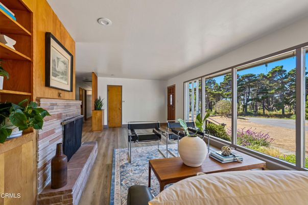 Fireplace, Interior, Living room, Recessed Lighting, Stone Walls, Water, Wood Texture Flooring