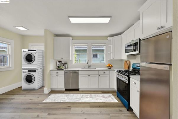 Interior, Kitchen, Recessed Lighting, Stainless Steel Appliances, Washer, Wood Texture Flooring