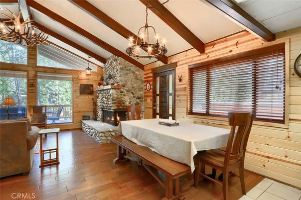 Chandelier, Dining room, Fireplace, Interior, Living room, Pendant Lights, Stone Walls, Wooden Beams, Wood Texture Flooring, Wooden Walls