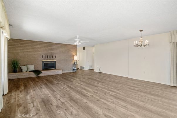 Chandelier, Empty room, Fireplace, Interior, Stone Walls, Wood Texture Flooring
