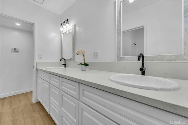 Bathroom, Dual Sink Vanities, Interior, Recessed Lighting, Wood Texture Flooring