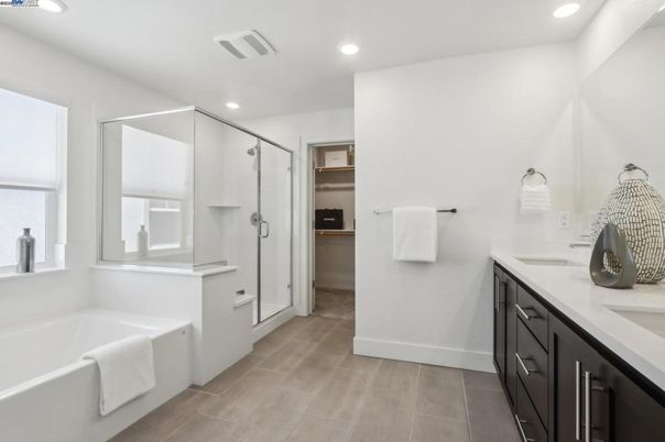 Bathroom, Dual Sink Vanities, Glass Shower, Interior, Recessed Lighting, Wood Texture Flooring