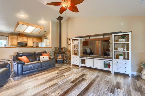 Fireplace, Interior, Kitchen, Living room, Recessed Lighting, Stainless Steel Appliances, Wood Texture Flooring