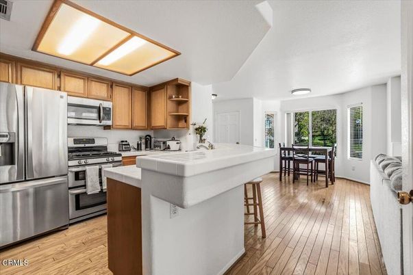 Dining room, Interior, Kitchen, Stainless Steel Appliances, Tile Countertops, Wood Texture Flooring