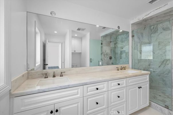 Bathroom, Dual Sink Vanities, Glass Shower, Interior, Marble, Marble Walls, Recessed Lighting