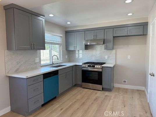 Interior, Kitchen, Marble Walls, Recessed Lighting, Stainless Steel Appliances, Wood Texture Flooring