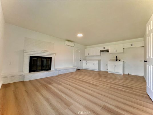 Empty room, Fireplace, Interior, Kitchen, Recessed Lighting, Wood Texture Flooring