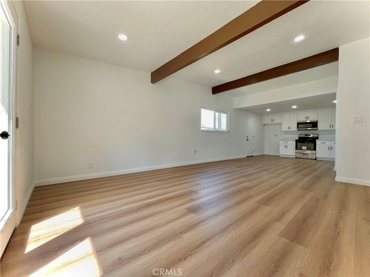 Empty room, Interior, Kitchen, Recessed Lighting, Stainless Steel Appliances, Wooden Beams, Wood Texture Flooring