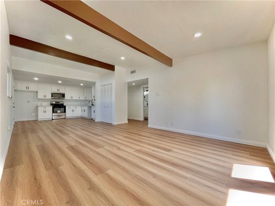 Empty room, Interior, Kitchen, Recessed Lighting, Stainless Steel Appliances, Wooden Beams, Wood Texture Flooring