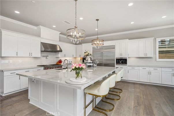 Chandelier, Interior, Kitchen, Pendant Lights, Recessed Lighting, Stainless Steel Appliances, Wood Texture Flooring
