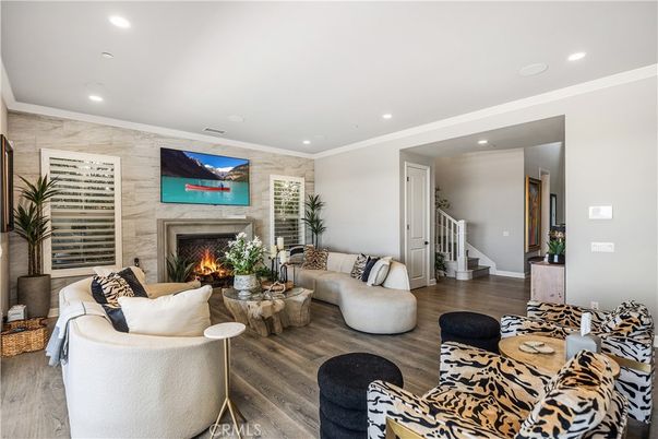 Fireplace, Interior, Living room, Recessed Lighting, Stone Walls, Wood Texture Flooring