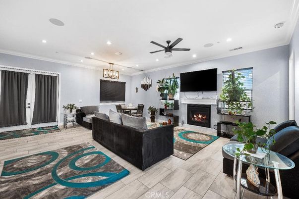 Dining room, Fireplace, Interior, Living room, Pendant Lights, Recessed Lighting, Wood Texture Flooring