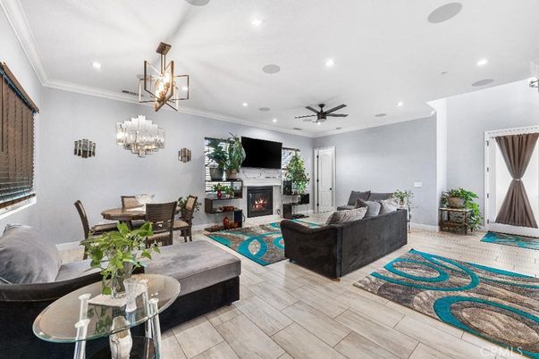 Dining room, Fireplace, Interior, Living room, Pendant Lights, Recessed Lighting, Wood Texture Flooring