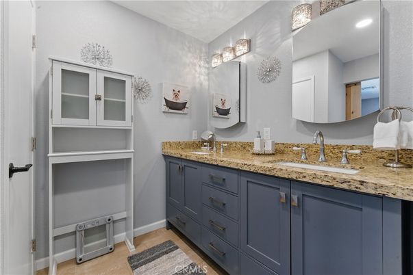 Bathroom, Dual Sink Vanities, Interior, Recessed Lighting, Wood Texture Flooring
