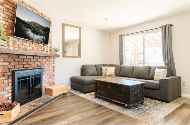 Fireplace, Interior, Living room, Recessed Lighting, Stone Walls, Wood Texture Flooring
