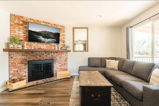 Fireplace, Interior, Living room, Recessed Lighting, Stone Walls, Wood Texture Flooring