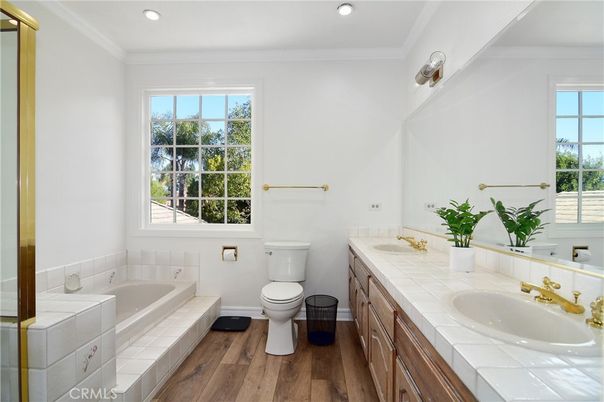 Bathroom, Dual Sink Vanities, Interior, Recessed Lighting, Tile Countertops, Wood Texture Flooring