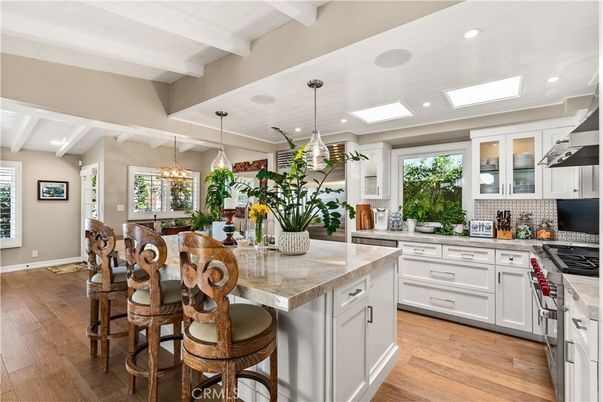Chandelier, Dining room, Interior, Kitchen, Pendant Lights, Recessed Lighting, Stainless Steel Appliances, Wood Texture Flooring