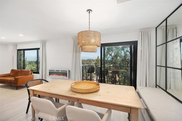 Chandelier, Dining room, Fireplace, Interior, Living room, Recessed Lighting, Wood Texture Flooring
