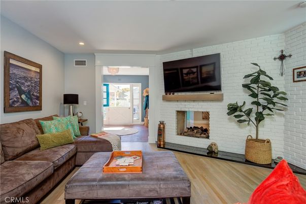 Fireplace, Interior, Living room, Recessed Lighting, Stone Walls, Wood Texture Flooring