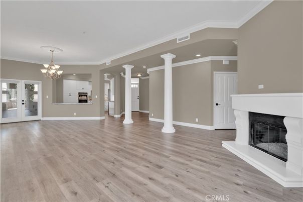Chandelier, Empty room, Fireplace, Interior, Recessed Lighting, Wood Texture Flooring