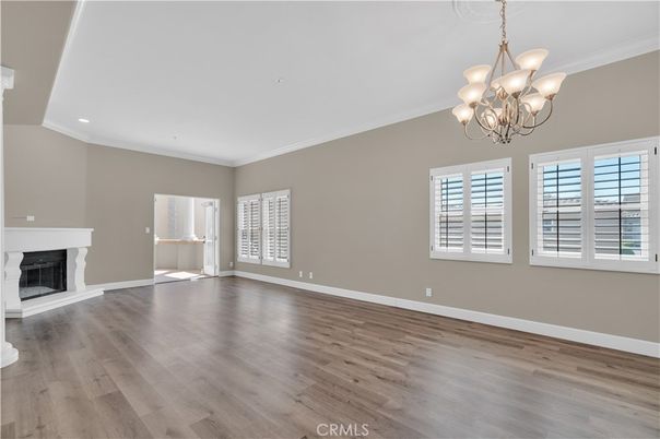 Chandelier, Empty room, Fireplace, Interior, Recessed Lighting, Wood Texture Flooring