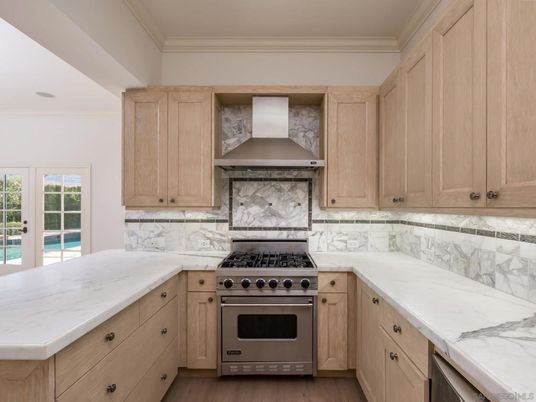 Interior, Kitchen, Marble Walls, Recessed Lighting, Stainless Steel Appliances, Wood Texture Flooring