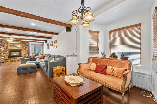 Fireplace, Interior, Living room, Pendant Lights, Recessed Lighting, Stone Walls, Wooden Beams, Wood Texture Flooring