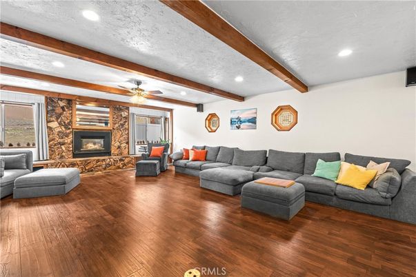 Fireplace, Interior, Living room, Recessed Lighting, Stone Walls, Wooden Beams, Wood Texture Flooring