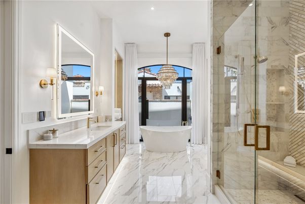 Bathroom, Chandelier, Dual Sink Vanities, Free Standing Baths, Glass Shower, Interior, Marble, Marble Walls, Recessed Lighting