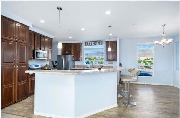 Chandelier, Interior, Kitchen, Pendant Lights, Recessed Lighting, Stainless Steel Appliances, Wood Texture Flooring