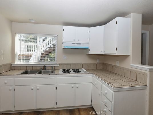 Interior, Kitchen, Tile Countertops, Wood Texture Flooring