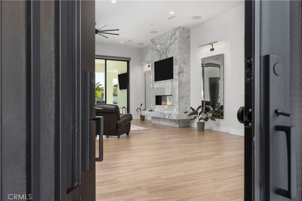 Fireplace, Interior, Living room, Marble Walls, Recessed Lighting, Wood Texture Flooring