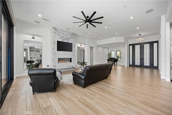 Fireplace, Interior, Living room, Pendant Lights, Piano, Recessed Lighting, Wood Texture Flooring