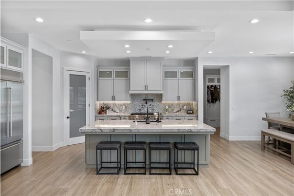 Interior, Kitchen, Marble Walls, Recessed Lighting, Stainless Steel Appliances, Wood Texture Flooring
