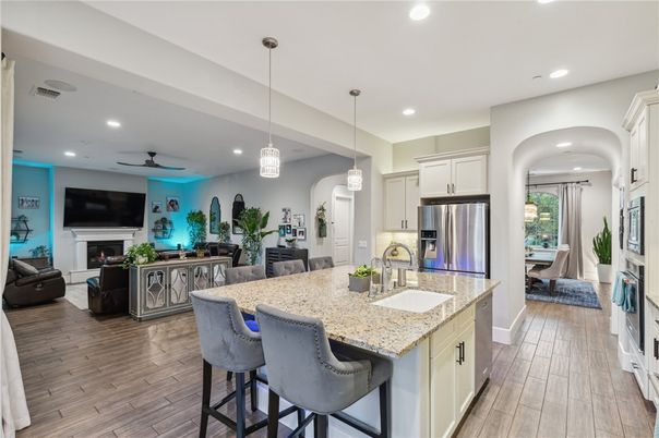 Dining room, Fireplace, Interior, Kitchen, Living room, Pendant Lights, Recessed Lighting, Stainless Steel Appliances, Wood Texture Flooring