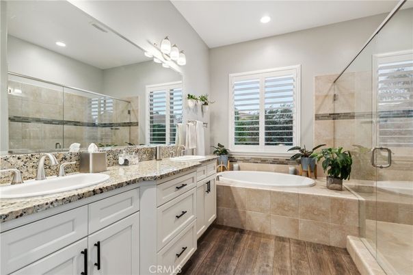 Bathroom, Dual Sink Vanities, Glass Shower, Interior, Recessed Lighting, Wood Texture Flooring